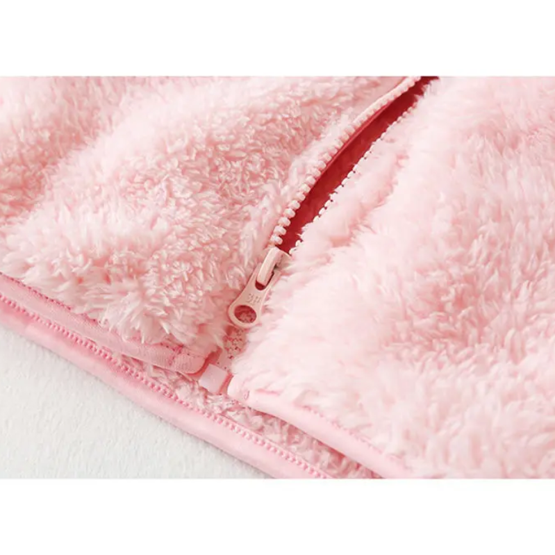 and a fluffy jacket with a zipper, fleece vest