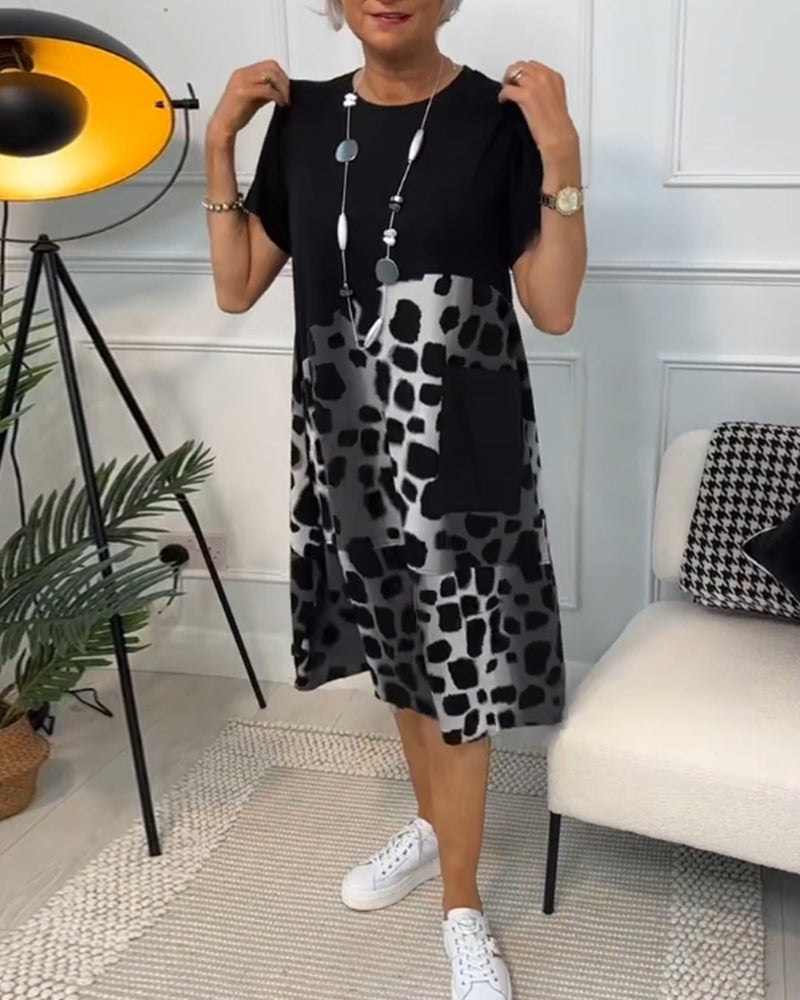 GR | Short-sleeved, printed dress with a round neckline