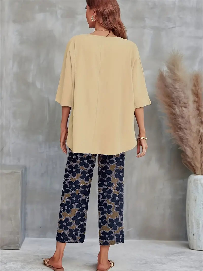 GR | Solid T-shirt with wide legs and round neckline with floral motif