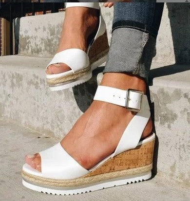 Sandals with buckled wedge heels