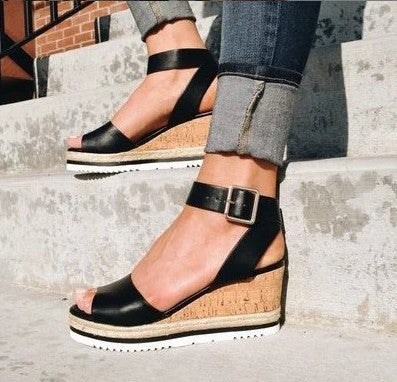 Sandals with buckled wedge heels