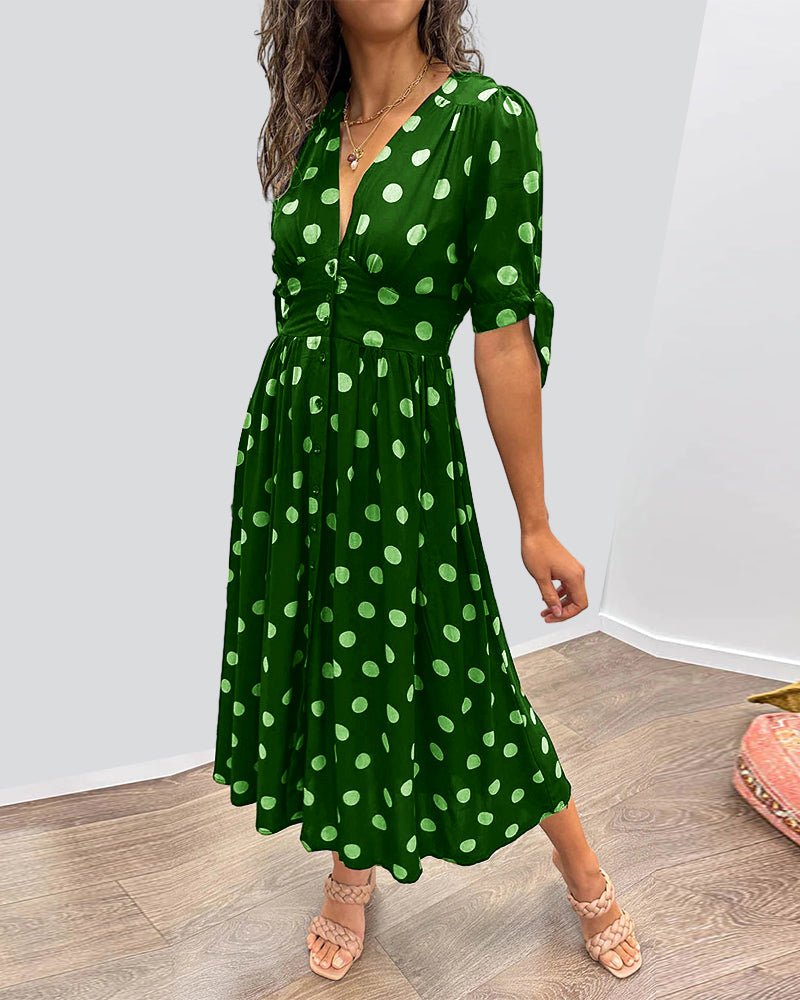 Dress with a deep V-neck and polka dots