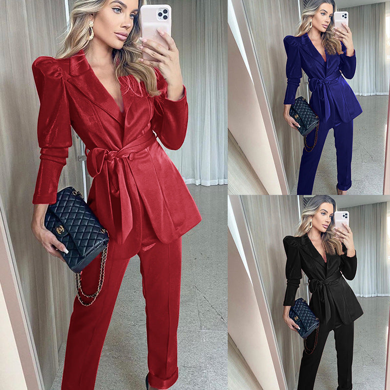 Women's blazer suit with voluminous puff sleeves and a tailored belt, size S