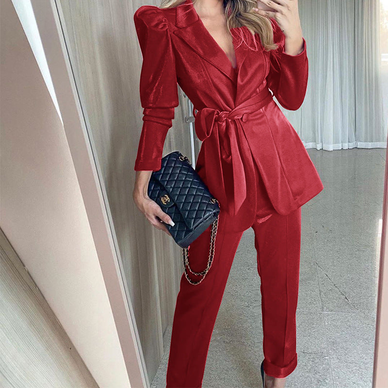 Women's blazer suit with voluminous puff sleeves and a tailored belt, size S