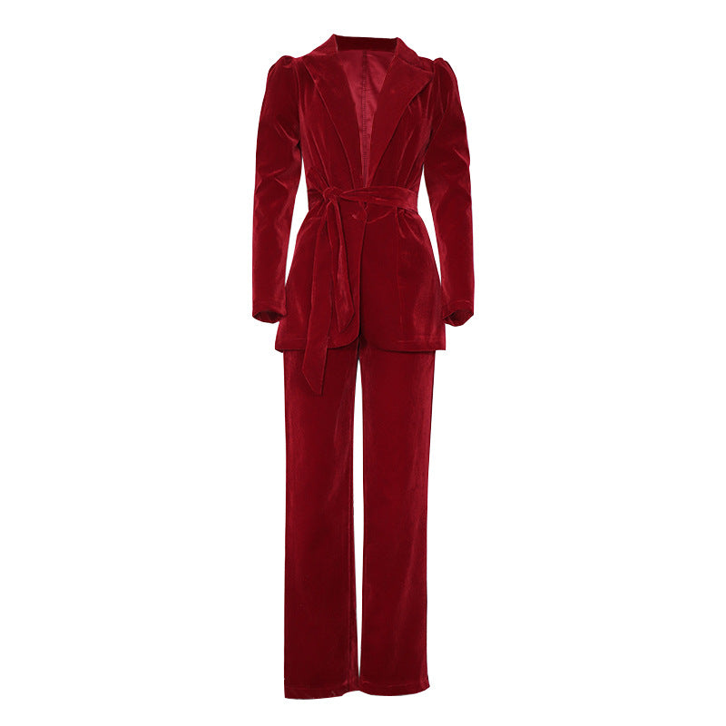 Women's blazer suit with voluminous puff sleeves and a tailored belt, size S