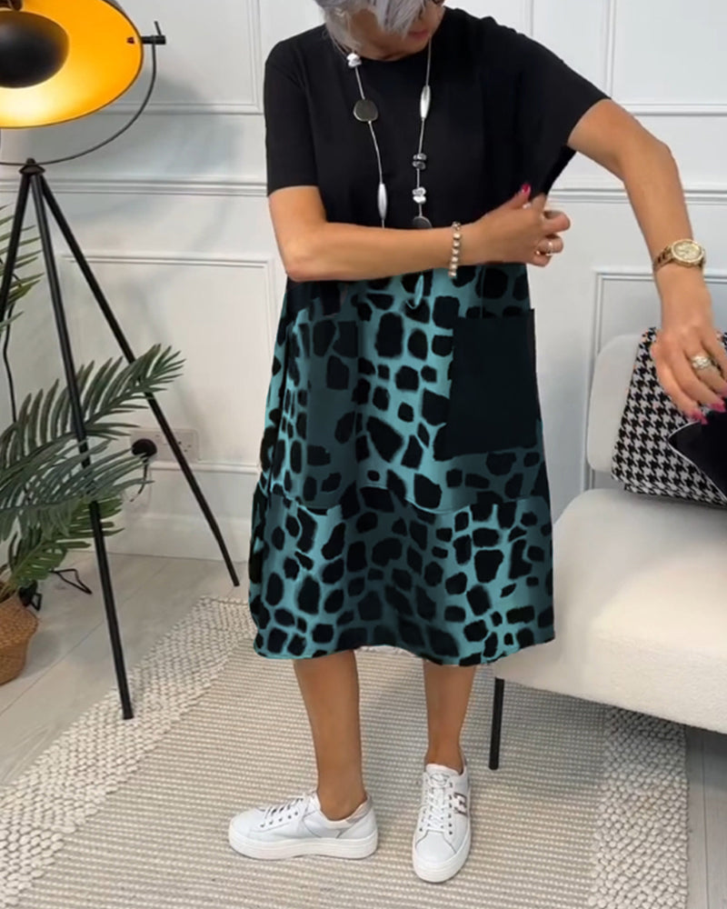 GR | Short-sleeved, printed dress with a round neckline