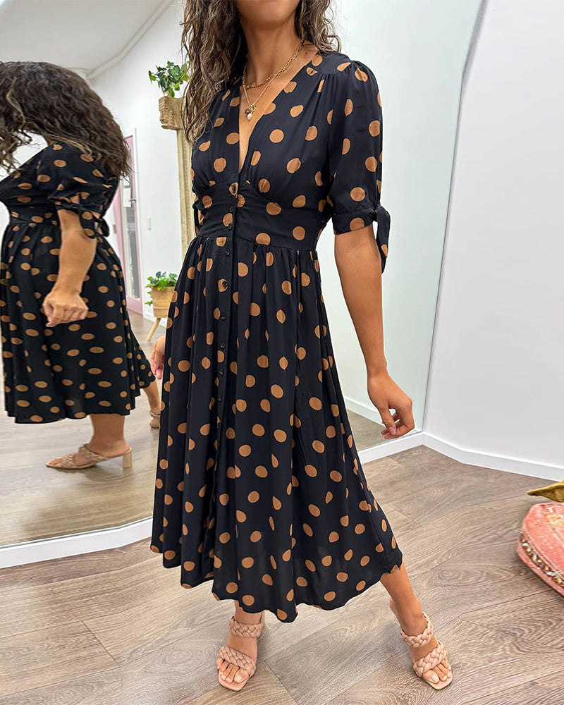 Dress with a deep V-neck and polka dots