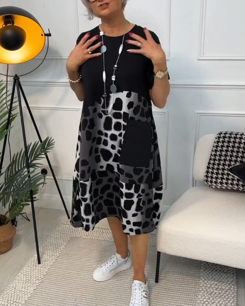 GR | Short-sleeved, printed dress with a round neckline