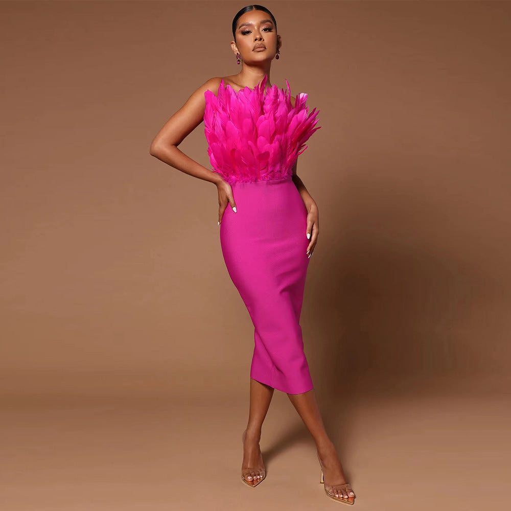 GR women's dress with waist accentuation and feather embellishment