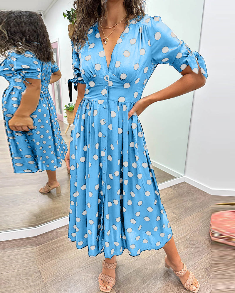 Dress with a deep V-neck and polka dots