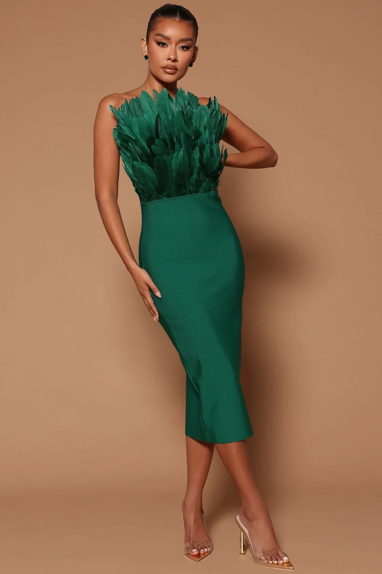 GR women's dress with waist accentuation and feather embellishment