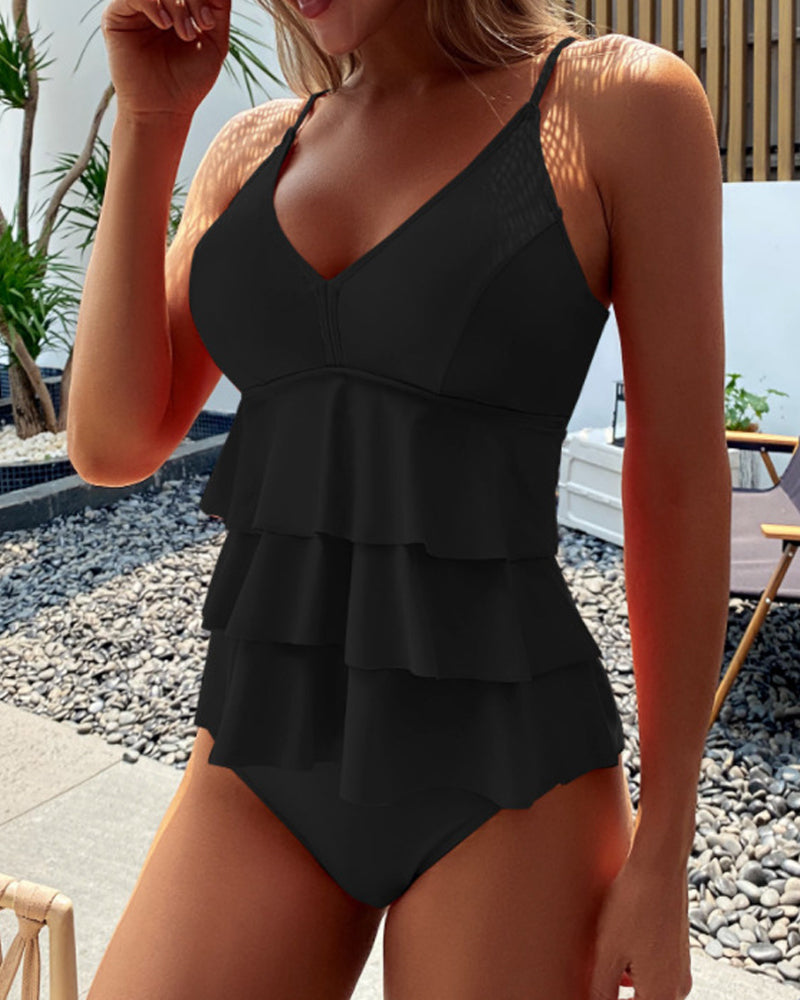 GR | Split-style tankini with ruffles in a solid color