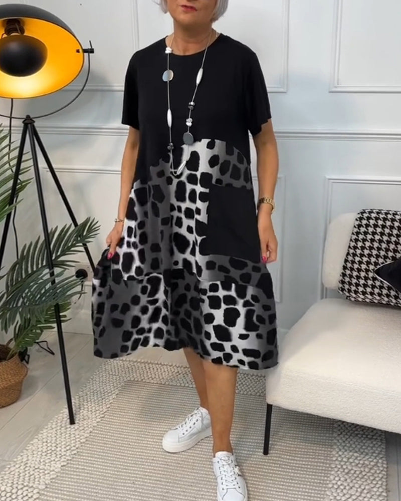 GR | Short-sleeved, printed dress with a round neckline