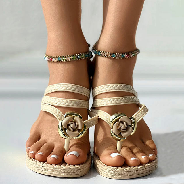 GR | Braided sandals with floral embellishment