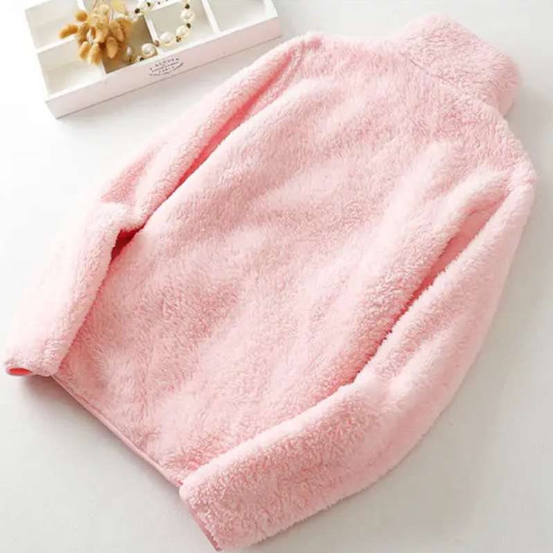 and a fluffy jacket with a zipper, fleece vest