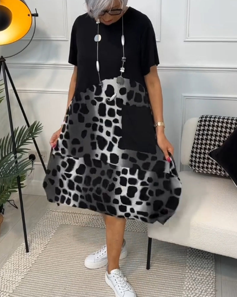 GR | Short-sleeved, printed dress with a round neckline