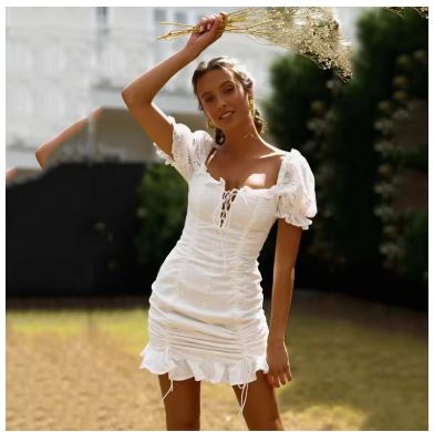 Women's mini dress with ruching and chic flounce, size