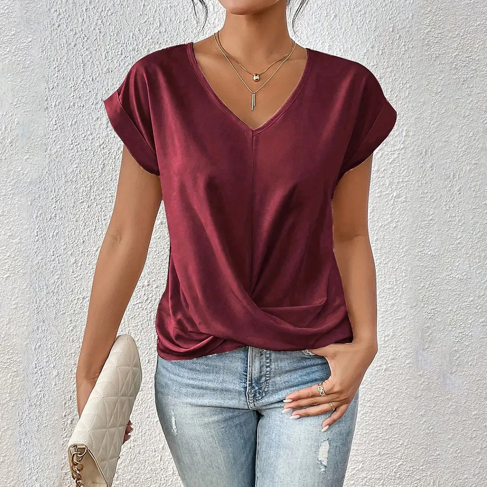 GR | Elegant, solid-color T-shirt with a V-neck and twisted hem for women