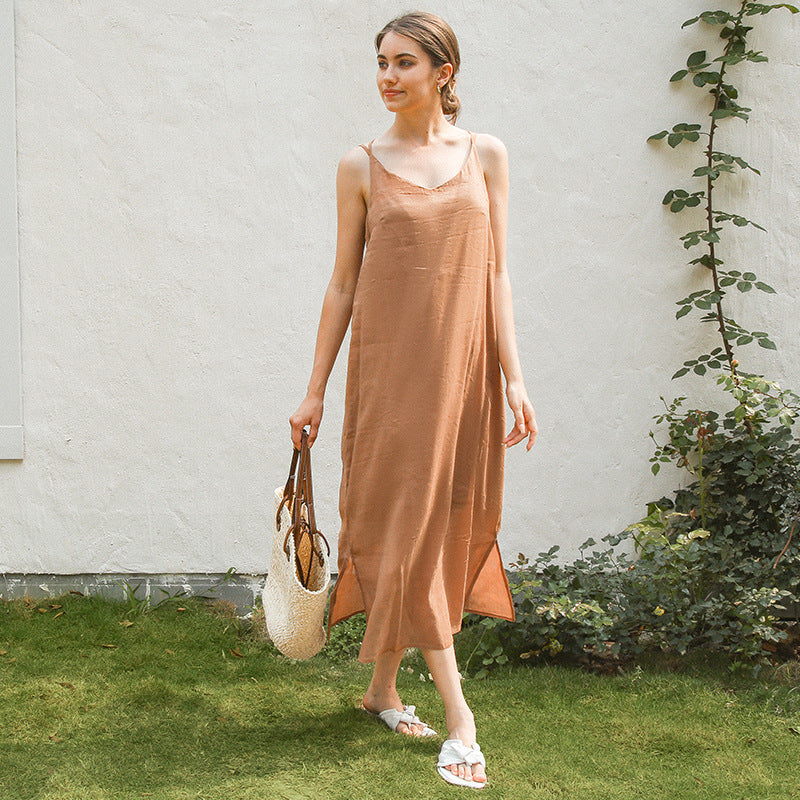 Women's elegant linen dress with adjustable spaghetti straps and flowing cut, size S