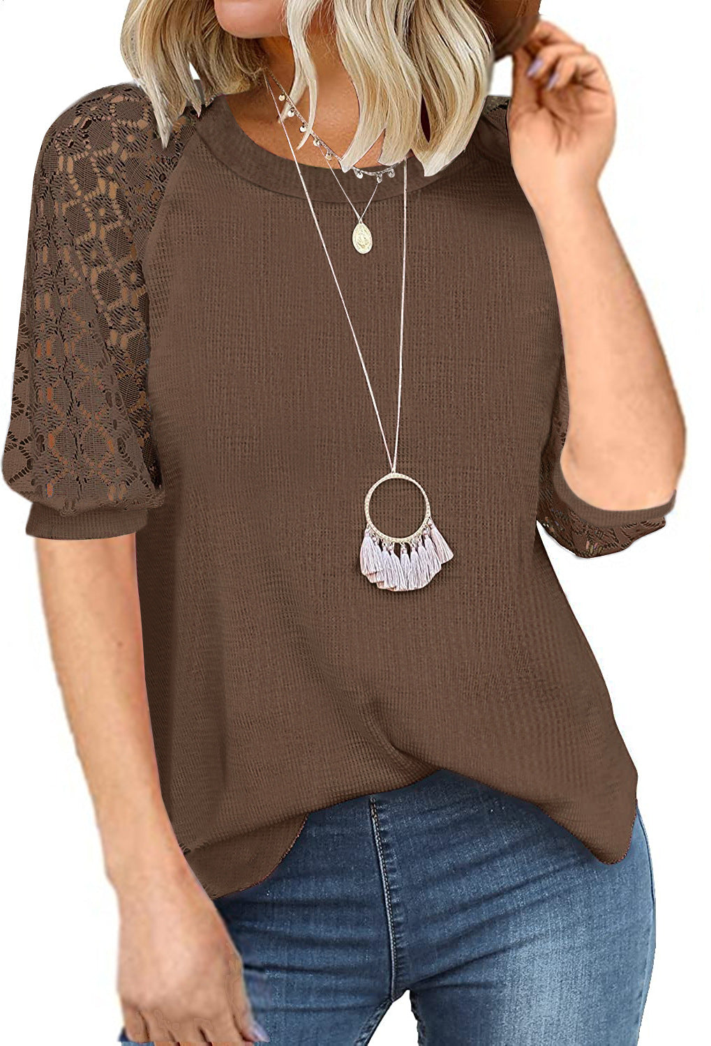 Women's top with lace sleeves and textured fabric, size