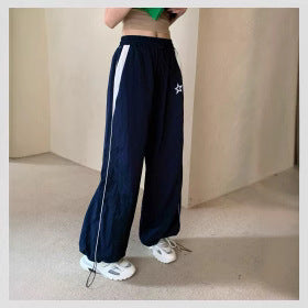 Women's sporty wide-leg trousers with side stripes and elasticated waistband, size