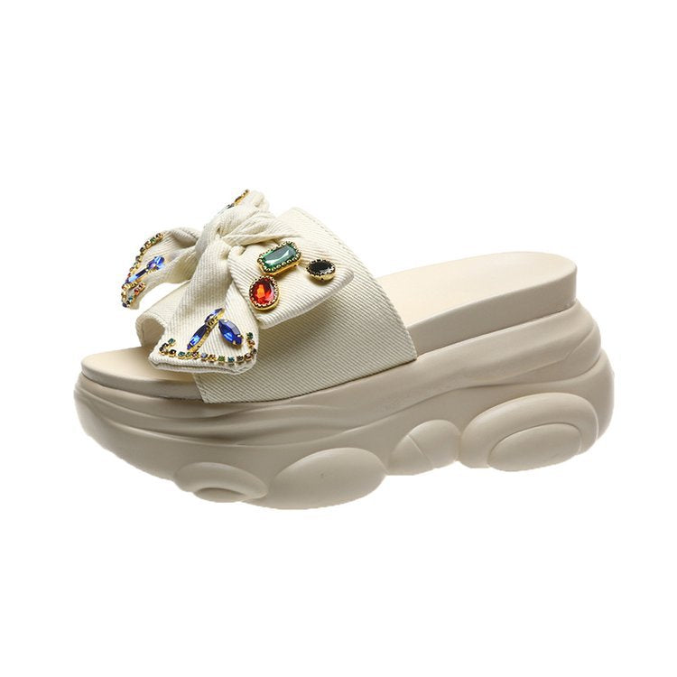Women's platform mules with decorative bow and rhinestone design, size GR