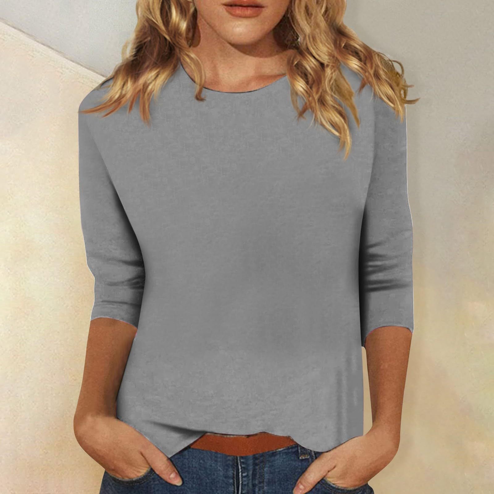 Women's casual top with elegant 3/4 sleeves and curved hem, size S