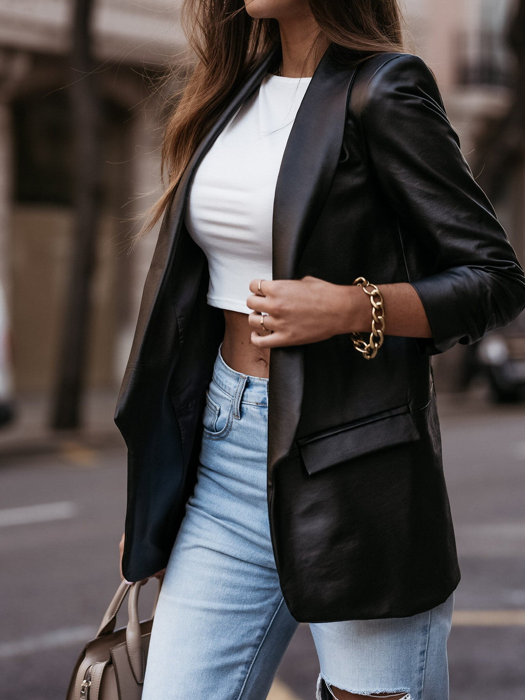 Women's faux leather blazer jacket with a modern cut and chic lapel, size [size missing]