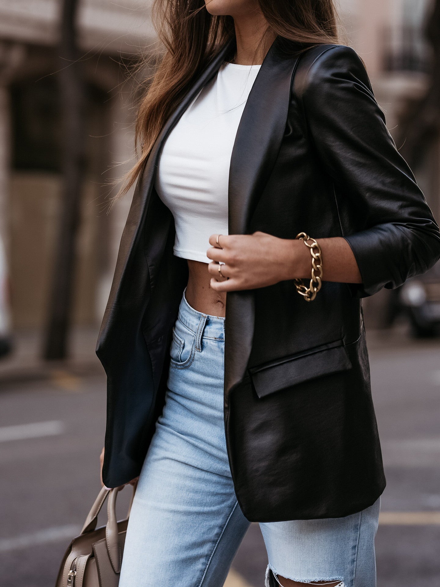 Women's faux leather blazer jacket with a modern cut and chic lapel, size [size missing]