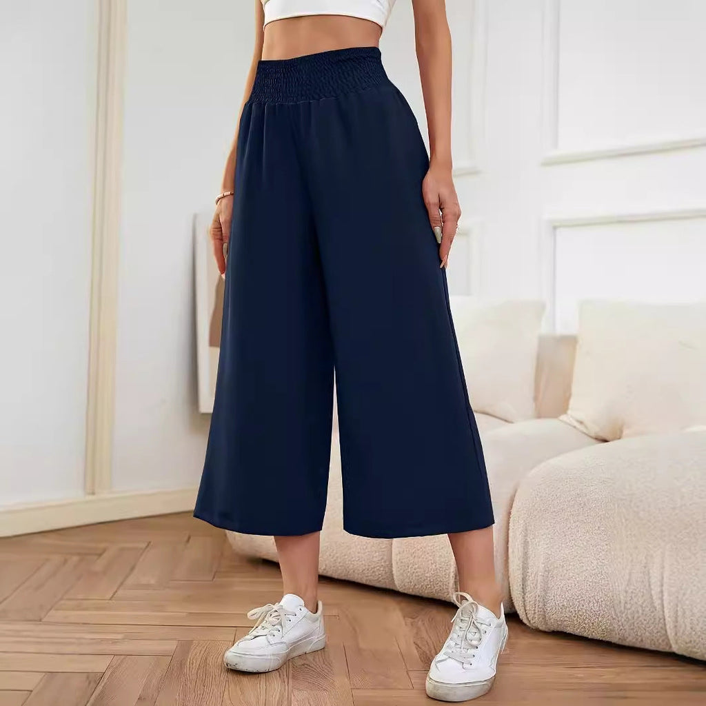 Women's wide-leg, high-waisted palazzo pants with elasticated waistband and flowing material, size S