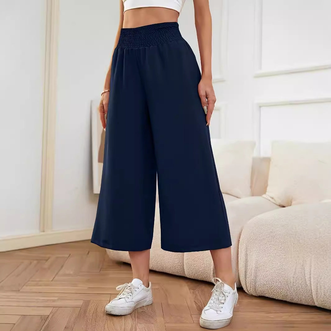 Women's wide-leg, high-waisted palazzo pants with elasticated waistband and flowing material, size S