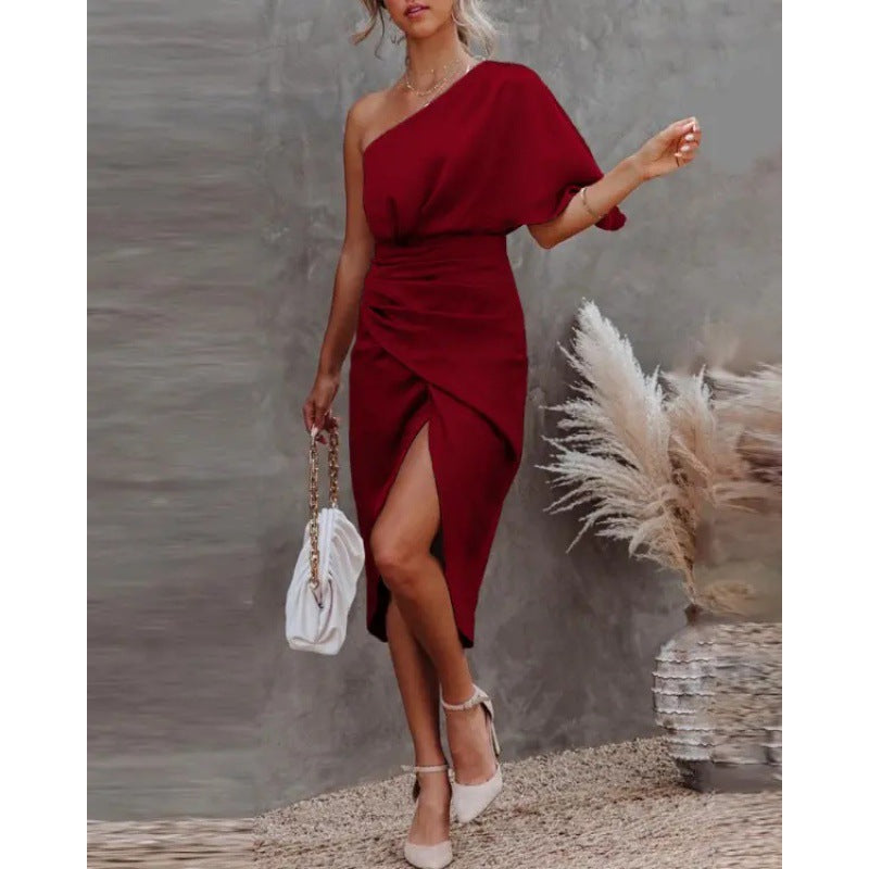 Women's chic, asymmetrical evening dress with an elegant slit and sophisticated draping, size GR