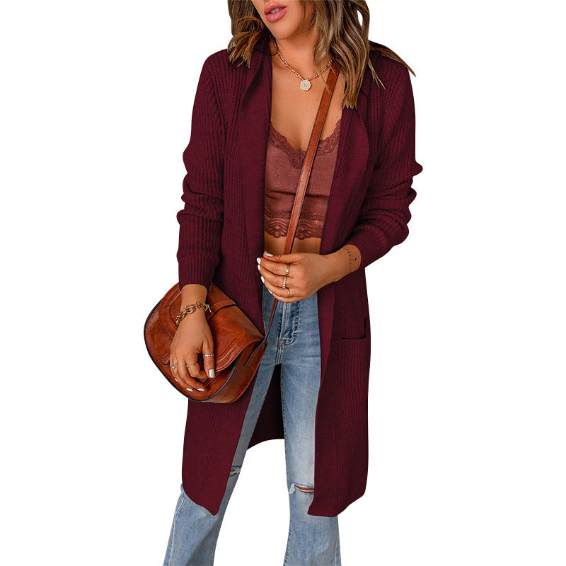 Women's knitted coat with deep V-neck and generous pockets, size