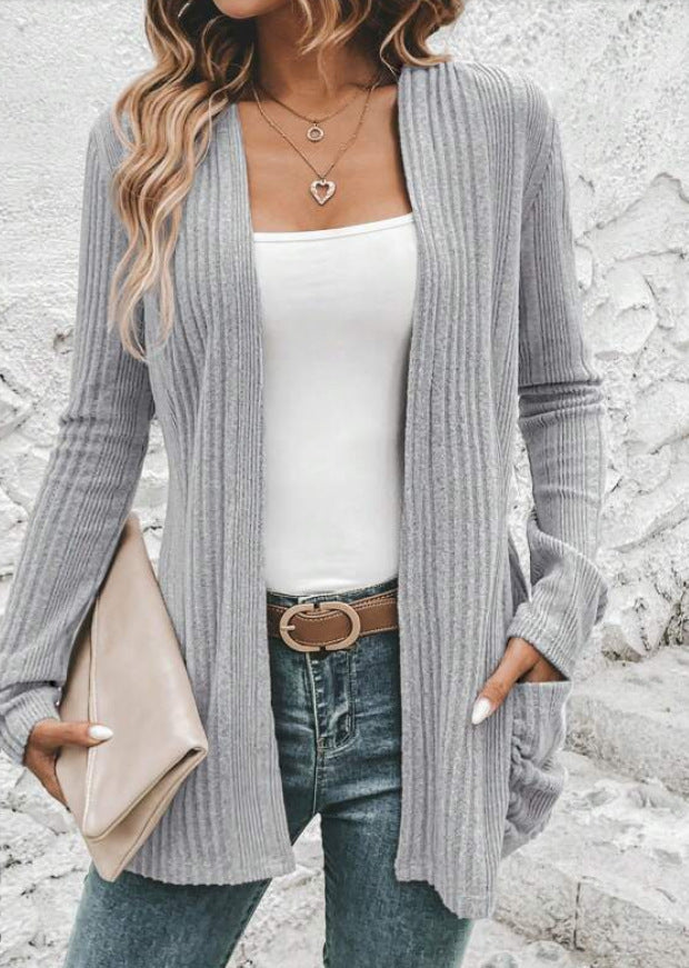 Women's fine knit cardigan with deep V-neck and practical pockets, size