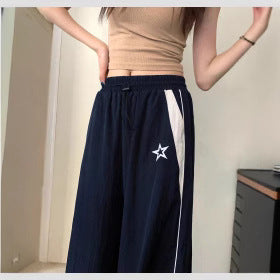 Women's sporty wide-leg trousers with side stripes and elasticated waistband, size