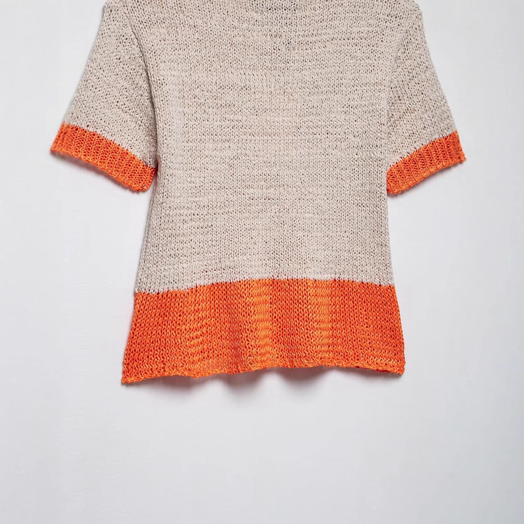 Women's knit top with contrasting color accents and a relaxed fit, size S