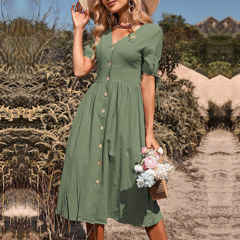 Women's midi dress with a tailored cut and modern button details, size [size]