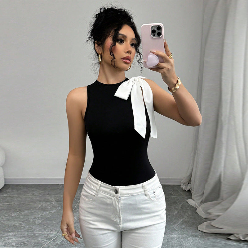 Women's sleeveless top with elegant bow appliqué, size
