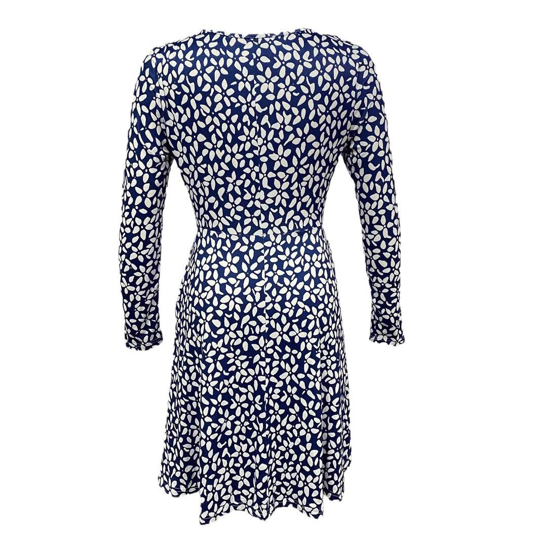 Women's blouse dress with floral design and practical pockets, size