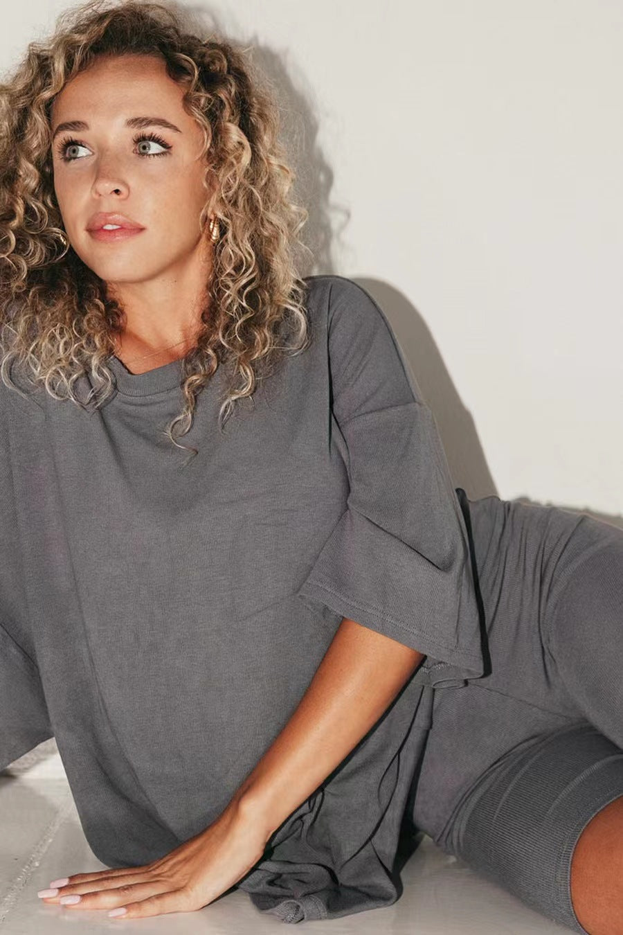 Women's comfortable oversized blouse with deep V-neck, size