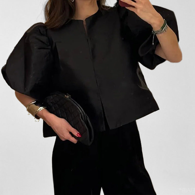 Women's blouse with voluminous puff sleeves and modern design, size S
