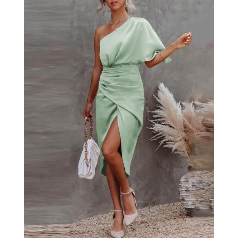 Women's chic, asymmetrical evening dress with an elegant slit and sophisticated draping, size GR