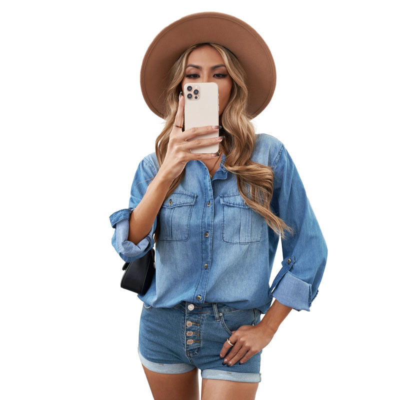 Women's denim shirt blouse with practical chest pockets and classic cut, size S