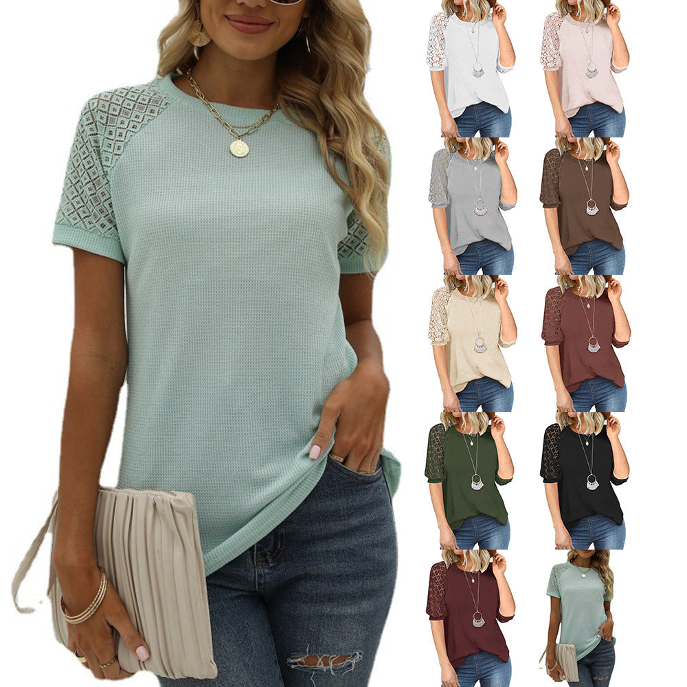 Women's top with lace sleeves and textured fabric, size