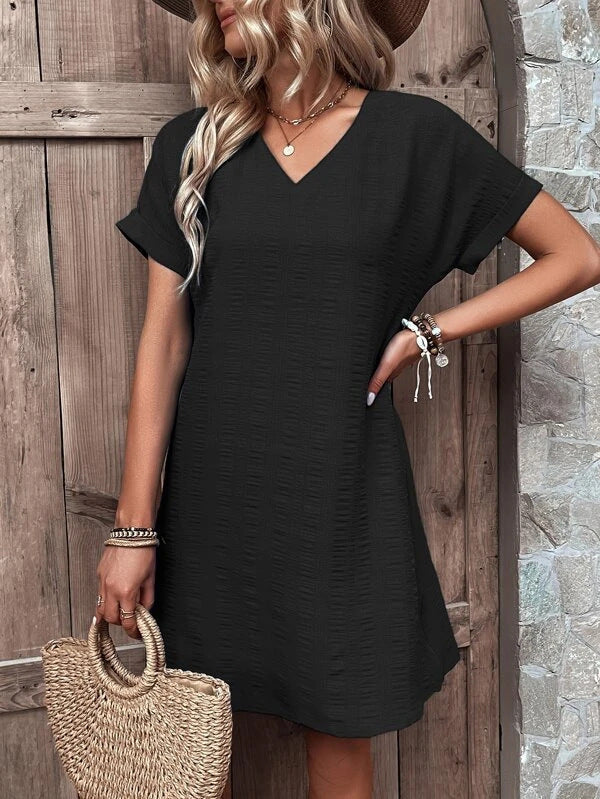 Women's casual V-neck dress with a wide cut