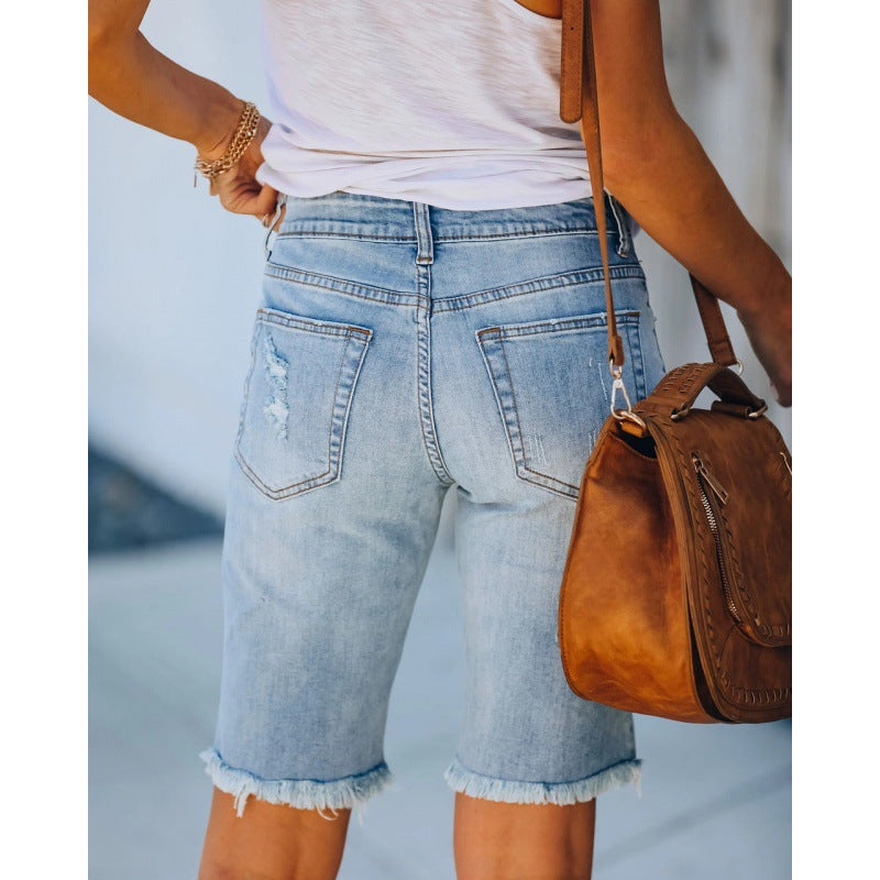 Women's distressed denim shorts in a relaxed fit with frayed hems, size [size missing]