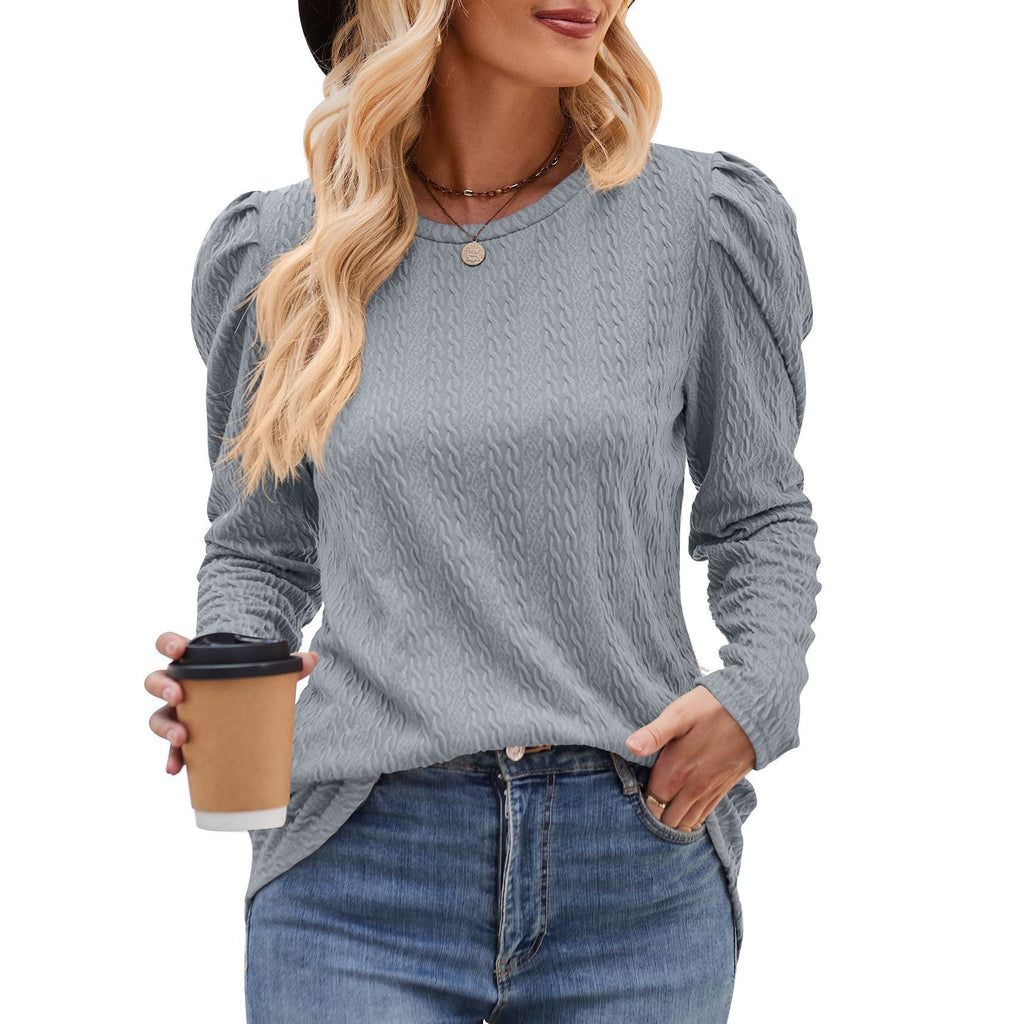 Women's elegant long-sleeved shirt with a textured pattern and puff sleeves, size