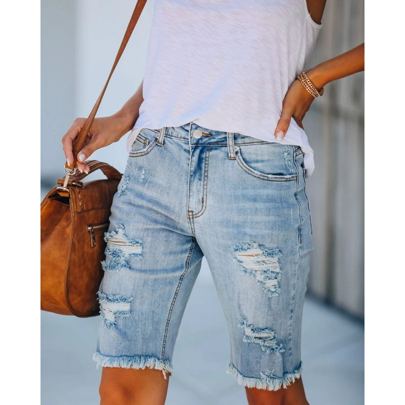 Women's distressed denim shorts in a relaxed fit with frayed hems, size [size missing]