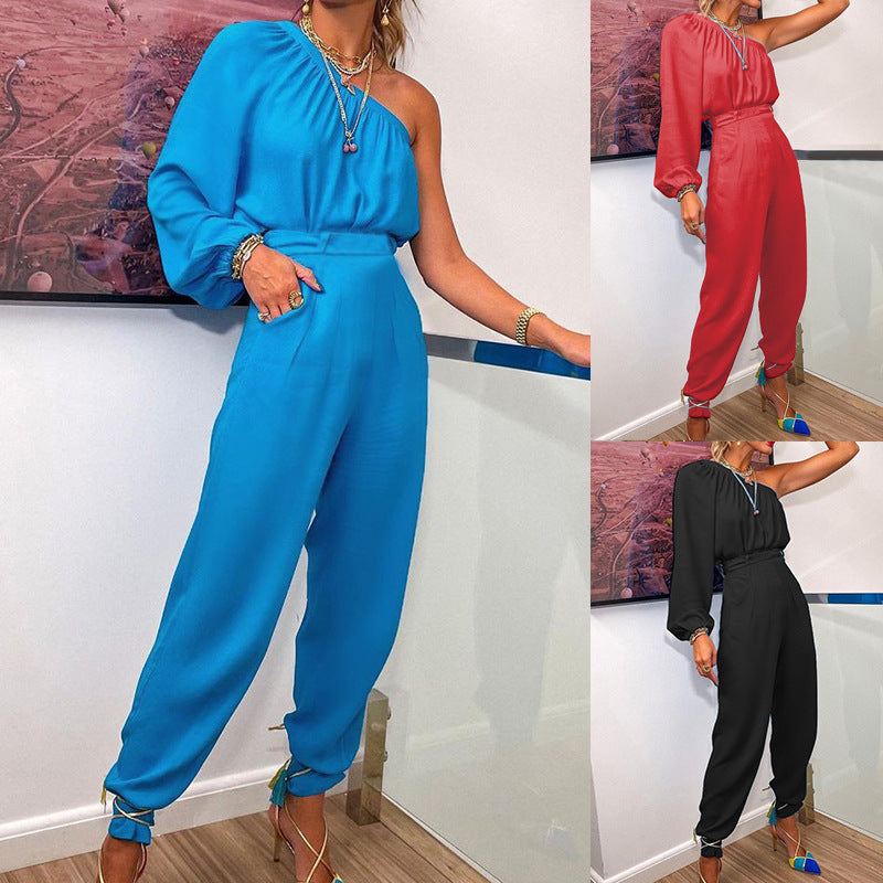 Women's jumpsuit with asymmetrical cut and elegant puff sleeves, size