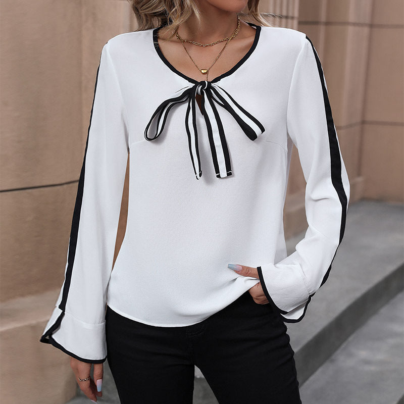 Women's blouse with decorative bow collar and contrasting sleeve cuffs, size [size missing]